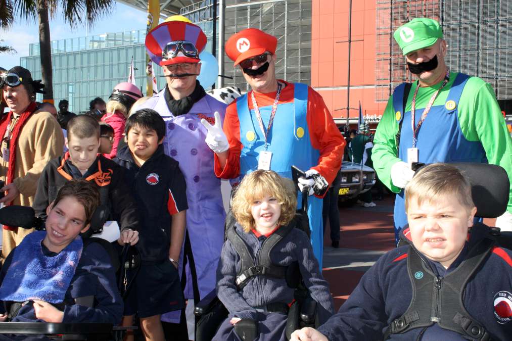 Students with people dressed up as Mario, Luigi and Wario